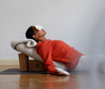 Erika Johanna Iluszko - Manas Yoga Studio owner in restorative pose